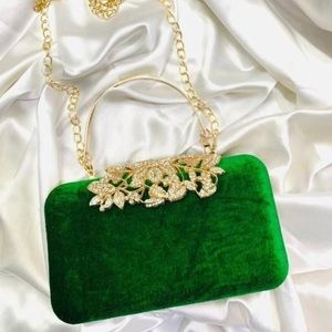 Brand new Green color clutch with golden color strap